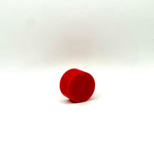 Load image into Gallery viewer, A small red cylindrical wax melt standing upright on a white studio background.
